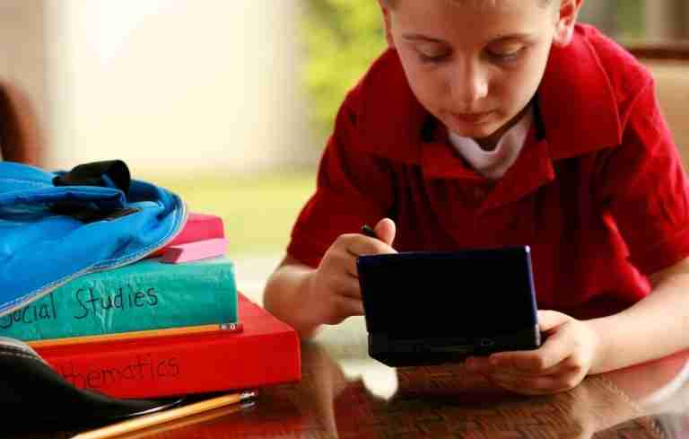 Child playing a handheld video game