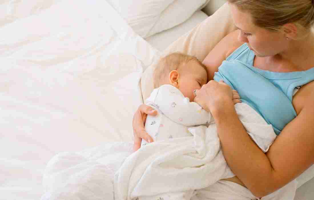 Parent breastfeeding an infant